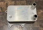 Oem Ford Engine Oil Cooler FL3E6A642AB Used. Price: $125.00.