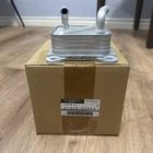 Genuine Nissan Oil Cooler Assembly 21305-6CA0A New. Price: $200.00.