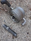 Oil Cooler - Subaru (21311AA090 Used. Price: $140.00.